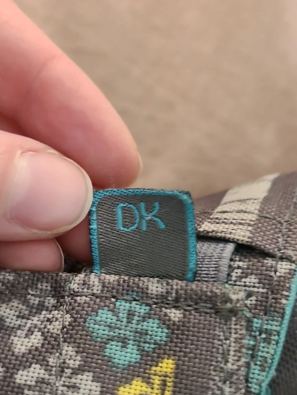 Gray Patterned Backpack with Aqua & Yellow Accents